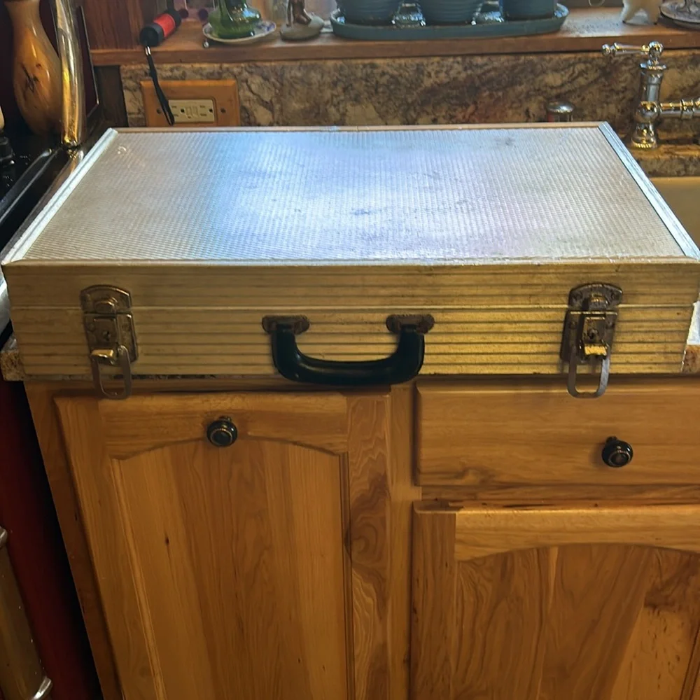 Aluminum padded case, handy for carrying anything; 24”long, 13.5”wide 4” deep
